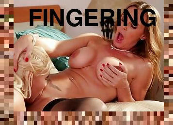 Girls in bed get hot and heavy with lusty fingers