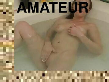 Cute chick in the bath showing off body