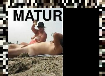 Fat mature couple having a wild fuck on the beach ends with cumshot