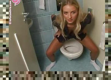 Beautiful Girl Taking A Piss In The Toilet.