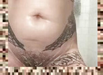 Inked Ginger shaving hairy pussy bush close up in the shower and playing with big firm natural boobs