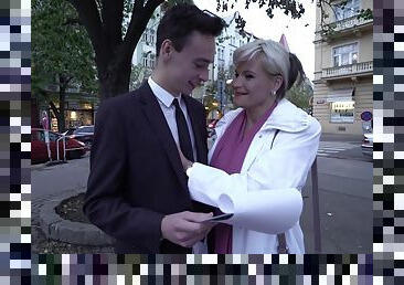 Mature blonde MILF Margaux M. picks up a younger guy on the street