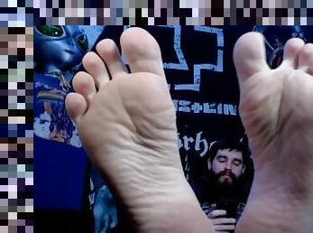 Bearded Metalhead Shows Feet While Playing on Phone