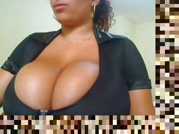 Busty brunette babe with huge tits stripteasing and seducing on webcam