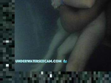Underwater interracial fuck in the pool with cumshot seen by hidden voyeur camera