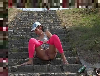 Chick drops her hot pink spandex to piss in public