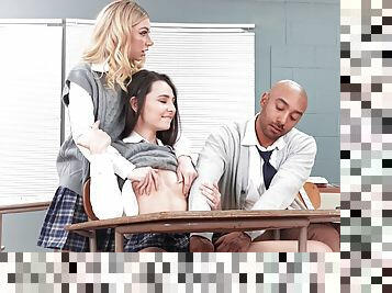 Special treat for pair of schoolgirls in energized threesome in class