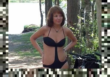 Swimsuit and dress modeling teen outdoors
