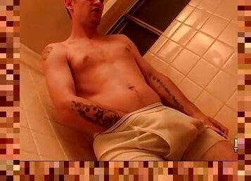 Cute guy pisses his briefs in the shower