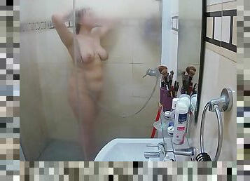 My wife  in the shower. Pure natural, totally unaware of the hidden camera in our bathroom.