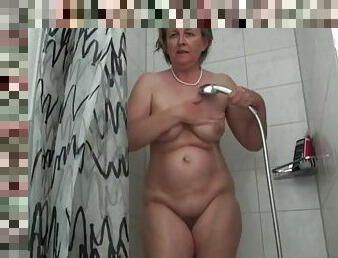 German grandma Frida enjoys the shower head