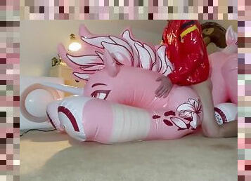 Riding my pink inflatable unicorn