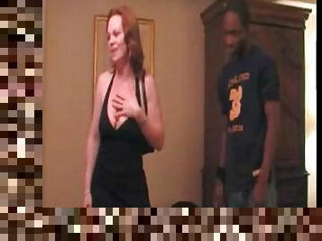 Redhead milf in stockings with big tits in gang bang penetration.