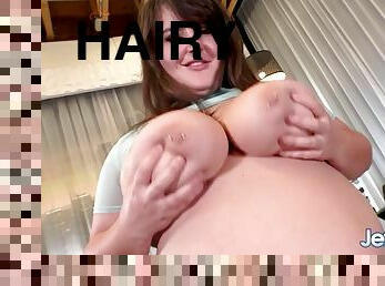 Big brunette Leila Lewis shoves a dildo in her pussy