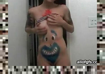 Teen camgirl shows off body paint and tattoos