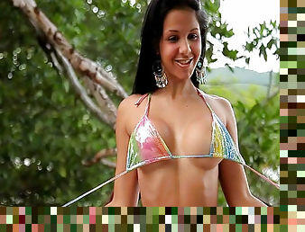 Magnificent Latina in bikini reveals her fake tits