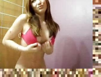 Homemade video of a hot babe showing off in front of the mirror