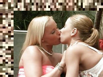 Kissing girls outdoors on a relaxing afternoon