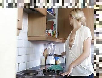 Chick teasing her tits while cleaning her kitchen