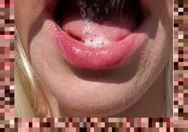 A nice teen is showing her wet smoky mouth tongue and uvula