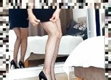 Lady Blonde in sexy clothes is waiting for a party. Fishnets, pantyhose, stockings, highhils.