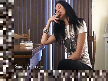Mina Gorey has a smoke while showing off her body