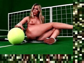 Perky blonde teen showing off her curves with a huge tennis racket