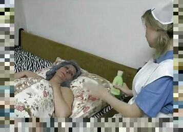 Cute nurse in lesbian foreplay with granny