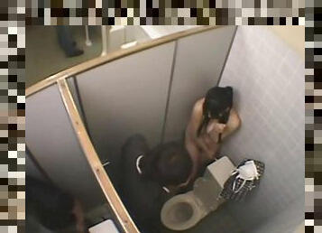 Girl gets naked in a public toilet with a pussy craving fellow