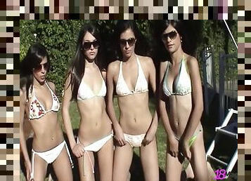 Bikini clad models enjoy an arousing outdoors photo shoot