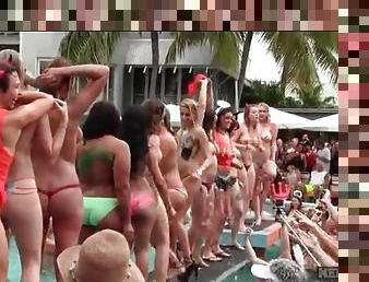 Lots of topless amateur hotties at a pool party