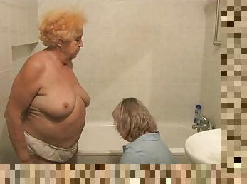 Granny gets a bath from her nurse