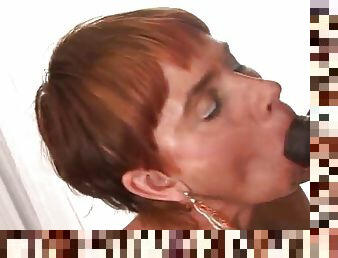 Redhead mature takes a pounding from a big black cock