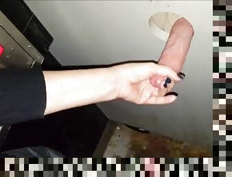 Girlfriend gives a handjob at the glory hole