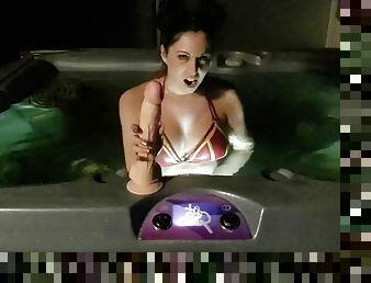 I play with a giant dildo in the jacuzzi