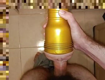 Hairy young man fucks the Fleshlight in the bedroom