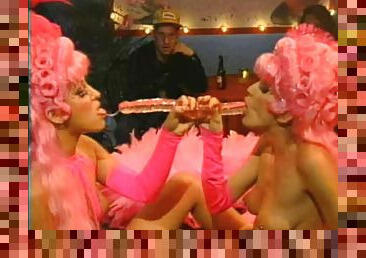 Two ladies with big pink wigs are going lesbian and looking awesome!