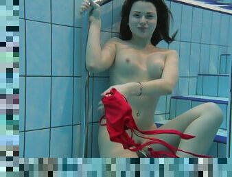 Lustful playgirl reveals her hot body under the water