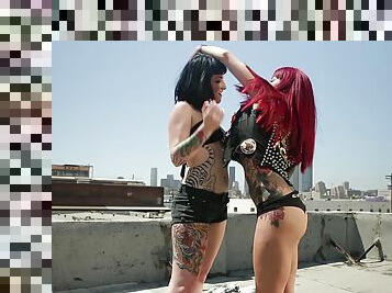 Lesbians sunbathing on a rooftop end up hooking up