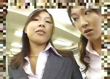 In the office a group of Japanese girls tit fuck a co-worker