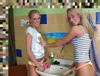 In the bathroom during a party two lesbian teens strip and fuck