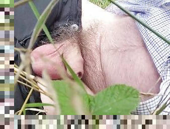 Masturbation  in nature near a field and forset