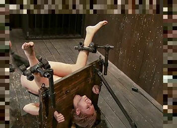 Katie Summers gets her vag toyed while being chained in pillory