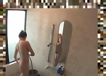 Hidden cam shows an Asian girl fucking in the shower