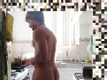 young latino Venezuelan cooking with his very sexy dark body