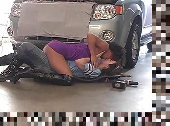 Lesbian mechanic licking and fingering horny girl in car service