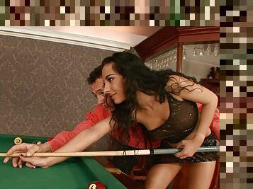 Brunette Babe Janet Joy Playing Pool with Two Big Cues