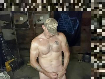 Sweaty village hunk jerks off cock in the garage