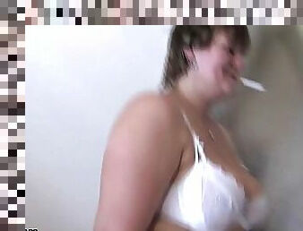 Big titted mature gets fucked while smoking