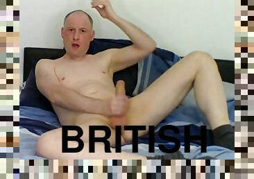 Kudoslong on the bed stripping and wanking till he ejaculates and spurts cum over himself
